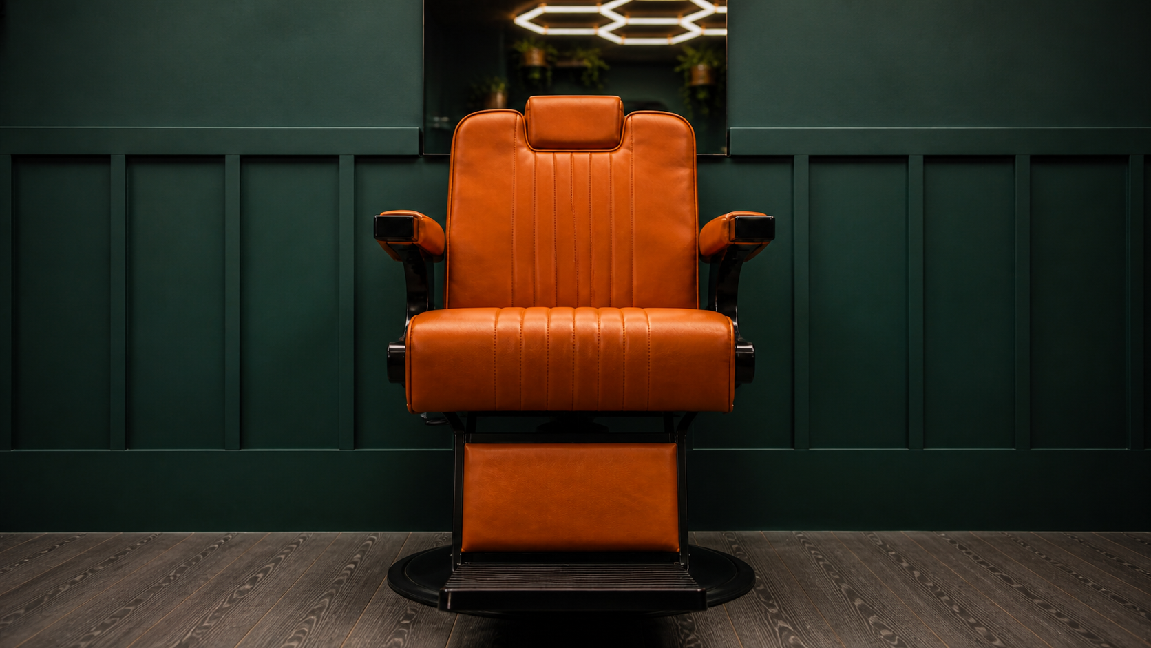 Barber chair facing the mirror station at JM Barber Co. in Lake Park, Florida