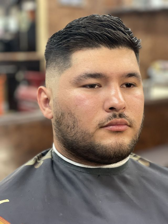 Slicked-back fade and full beard at JM Barber Co., Lake Park, FL